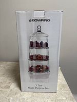 Photo of the boxed Bowring 3-tier stacking jars with image of the jars filled with colorful items on the front of the box.