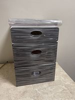 Stacking storage containers with textured gray fronts and white sides