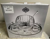 Box showing image of the 9-piece crystal punch set with punch bowl and eight cups. Tray and ladle are shown but labeled as not included.