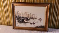 Framed oil painting showing the entire artwork depicting an Asian harbor with multiple boats.