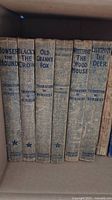Spines of 6 Thornton W. Burgess books showing titles and worn cloth covers