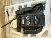 Top view of the GI Joe Mobile Field Unit walkie talkie in white foam packaging showing the device with antenna and handset.