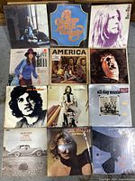 Top view showing all 12 classic rock vinyl albums arranged in a 4x3 grid.