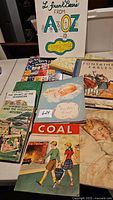 Photo showing a variety of children's books including L. Frank Baum's From A to Z, Coal, Fontaine Fables, and mystery stories.
