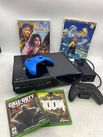 Overview of Xbox One console, controllers, games and guide books as a whole bundle.