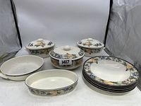 Full set of Mikasa Garden Harvest pieces showing 3 baking dishes with lids, 2 serving platters and 5 dinner plates.