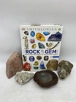 Photo of Smithsonian Rock & Gem book with four natural rocks arranged at the base