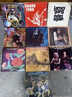 Photo showing all 10 rock albums arranged in a grid on floor surface