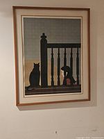 Front view of framed lithograph hanging on wall