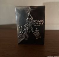 Front of the Star Wars Trilogy DVD box set with embossed characters.