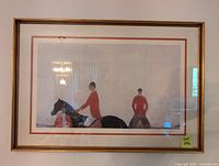 Full view of framed art print showing jockeys on horses, with gold frame and double matting.