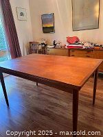 Front diagonal view showing overall shape, legs, and tabletop