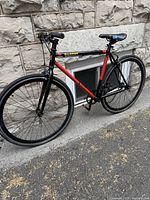 Photo of the side profile of the Butter single speed bicycle showing the full frame, tires, and saddle.