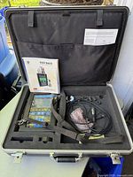 Open case showing analyzer unit, manual and accessories