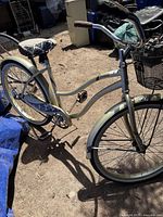 Side view of the Huffy Cranbrook bicycle showing frame, seat, handlebars with basket, wheels with fenders.