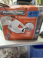 Worn original box of Proctor Silex 5 speed mixer showing product image, features and condition