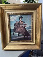 Frontal view showing the full painting and gilded wood frame with visible age-related wear and damage to the canvas.