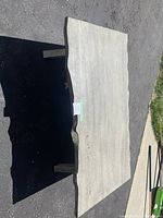 Top view of coffee table showing the natural edge and surface wear like scratches.