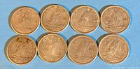 Eight Canadian 10 cent silver dime coins arranged in two rows on a blue surface showing obverse details and overall wear.