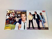 Photo showing group band shot and album cover known as 'Fore!', featuring 4 band members casually standing against a wall with the album title and band name at top.