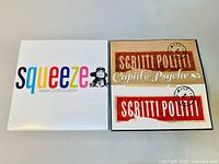 Image showing the front covers of two vinyl LP albums: Squeeze and Scritti Politti 'Cupid & Psyche 85', placed side by side on a white surface.