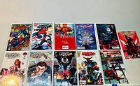 Full lot of 11 Spider-Man comics displayed on a flat surface, showing front covers and bagged with boards