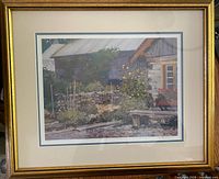Framed print titled 'From a Country Garden' showing the entire artwork and frame with a country garden scene and building in the background.