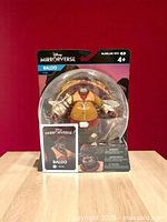 Front view of Disney Mirrorverse Baloo action figure in sealed packaging with character card visible in front.