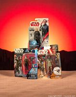 Three unopened Star Wars Hasbro action figures displayed together with original packaging showing characters General Hux, Sergeant Jyn Erso, and Constable Zuvio.