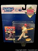 Front view of Juan Gonzalez 1995 Starting Lineup Texas Rangers action figure sealed in original blister packaging with trading card visible.
