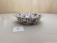 Side view of the pansy floral bowl showing overall shape and design with gold trim on rim