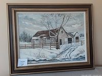 Framed oil painting "Stone Barn" showing a snowy barn landscape with tree and fence, sized 18 x 24" painting on 31 x 25" frame.
