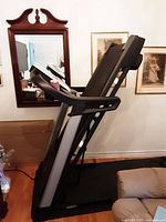 Side view of treadmill in folded position