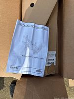 Open box showing instruction manual labeled 'Medium Universal Interface Bracket' by Chief MSBU.