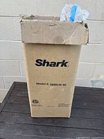 Box with Shark branding and model number S6001W showing external packaging condition.