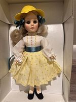 Full front view of the Effanbee Goldilocks doll in original packaging, showing outfit details.
