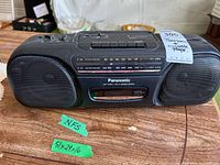 Full front view of black Panasonic RX-FS430 stereo cassette player showing speakers, cassette compartment, brand name and model info on label.