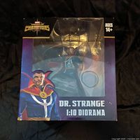 Front of original box with visible Dr Strange figure and character artwork, some corner damage on box
