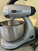Full view of silver stand mixer with bowl attached