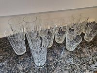 17 vintage crystal Cross and Olive tumbler glasses arranged on counter, showing all sizes