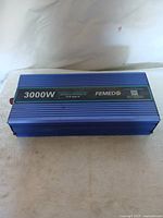 Top view of FEMED 3000W power inverter showing brand, model, and power rating.