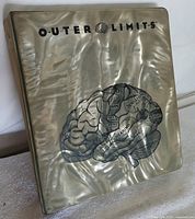 Pearlescent binder cover featuring a detailed brain illustration and the 'Outer Limits' title