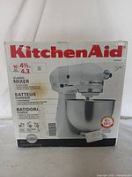 Front of original box showing KitchenAid logo, mixer image, 10-speed and 4½ Qt spec.
