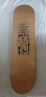 Top side of skateboard deck showing graphic of two women and 'CUT THROAT FREAK SHOW!' text