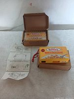 Two Velveeta Shells & Cheese disposable cameras with their original cardboard shipping boxes and instructions