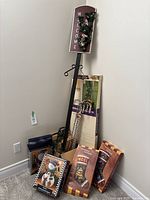 Full view of Christmas decorations against wall including 'Welcome' sign, candy cane, and decorative boxes