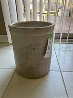 Front view of 3 gallon stoneware crock pot showing full body and crown logo.