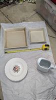 Two square Simon Pearce dishes, one larger about 12 inches, one smaller about 8 inches, one Spode botanical plate and small white ceramic pitcher