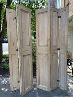 Four-panel screen assembled from two hinged pine shutters, showing overall configuration