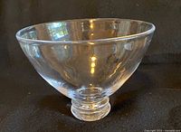 Side view of a Simon Pearce Cavendish medium glass bowl showing its rounded shape and pedestal base.